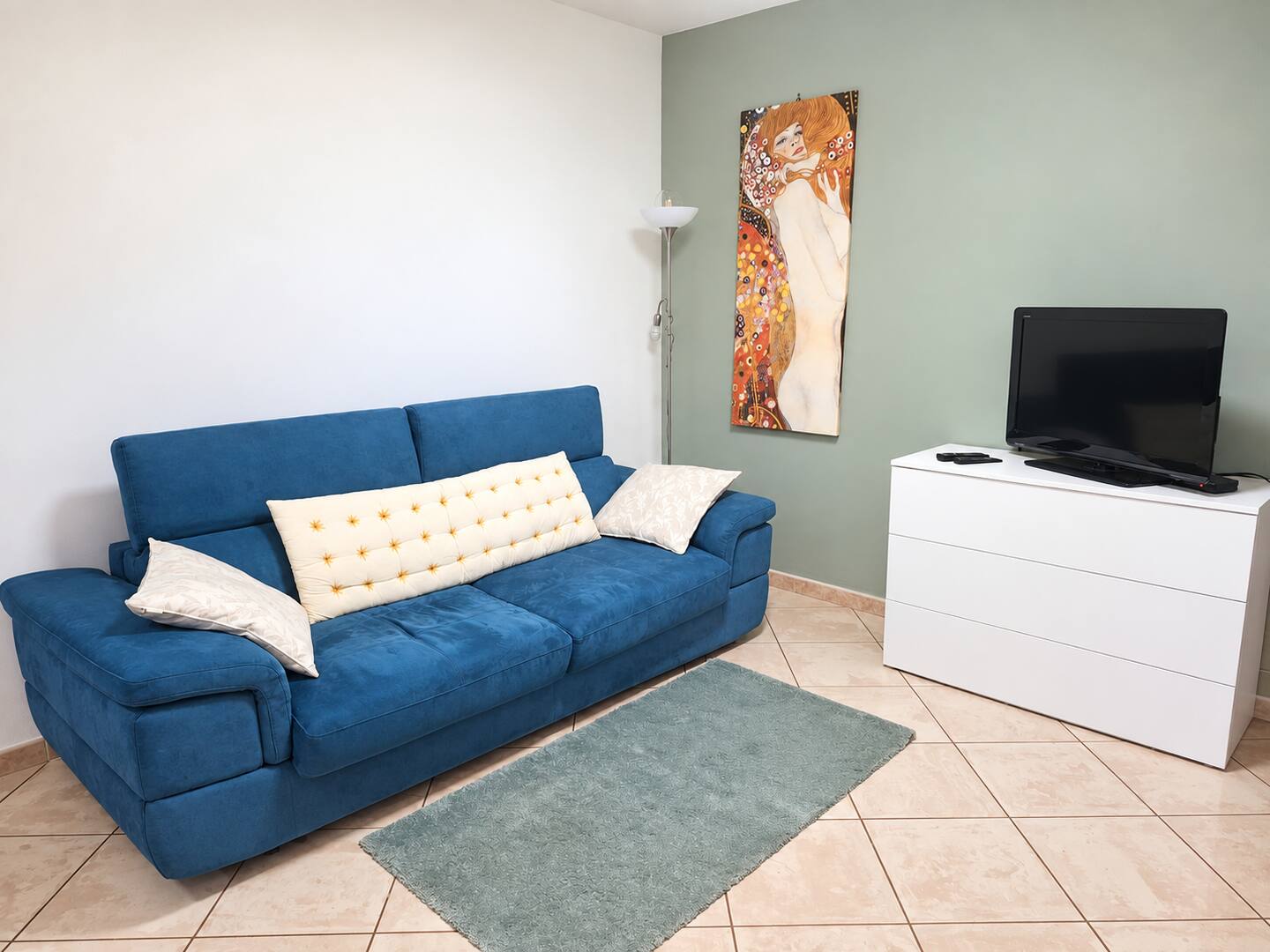 The blue double sofa bed in the apartment