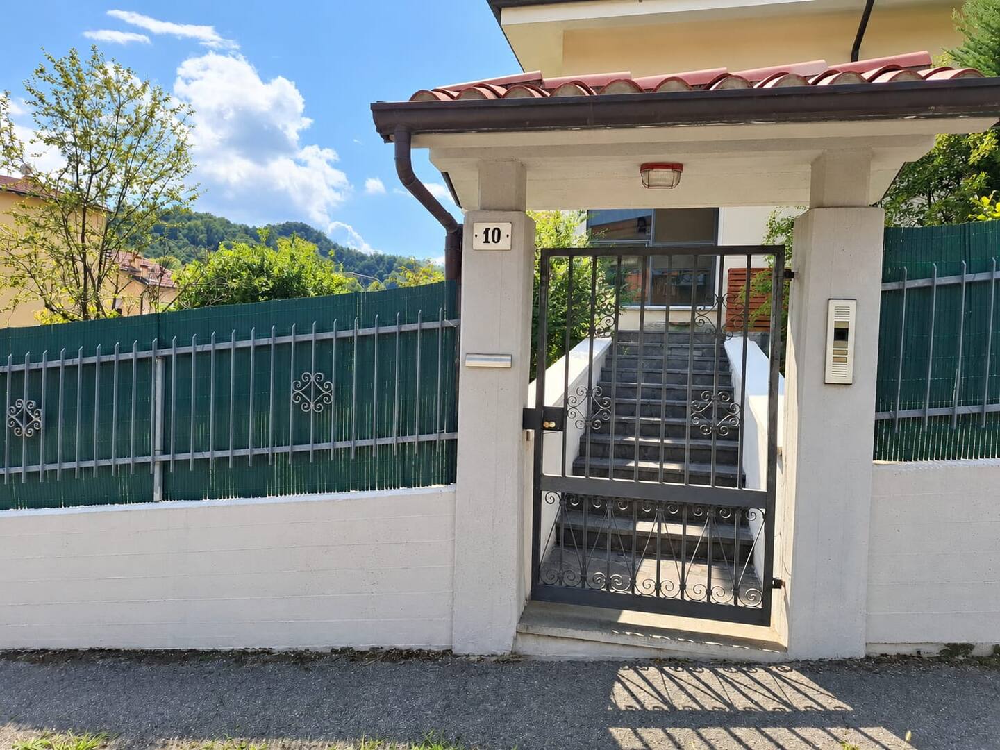 The pedestrian gate at number 10, with the stairs up to the upper floor