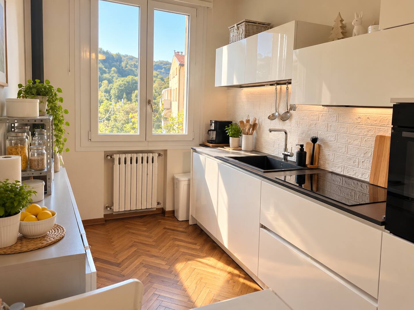The white upper-floor kitchen, with the window open onto the hills