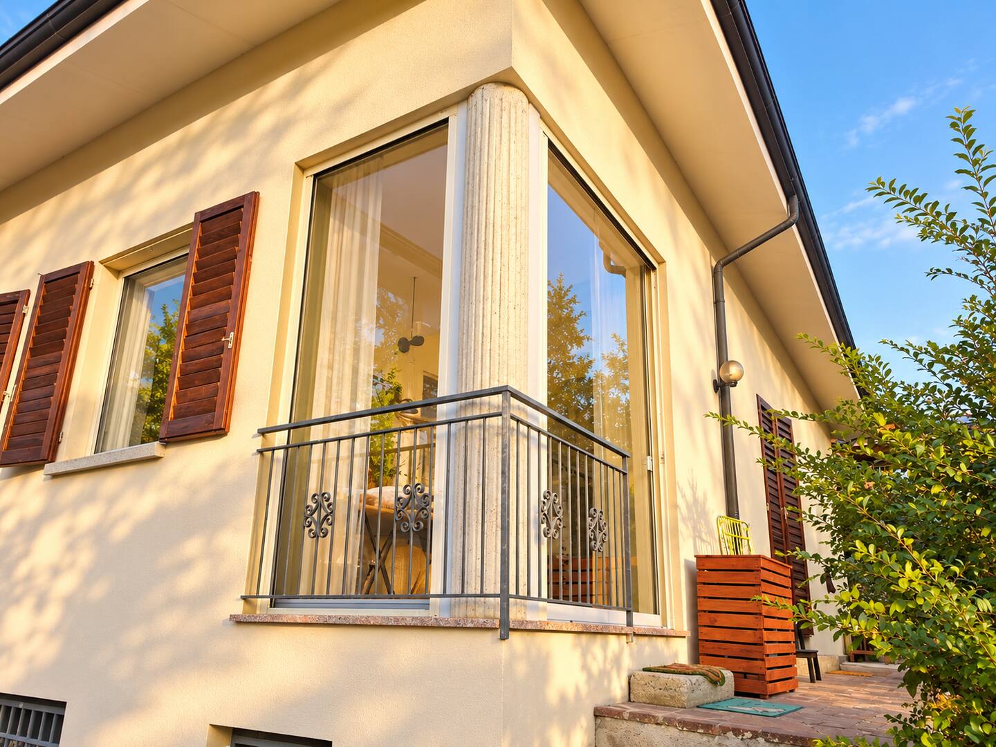 The veranda seen from outside, with its wooden shutters
